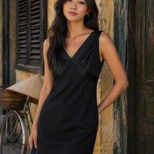 Vintage Black satin trim bodycon dress with V-neckline and zipper back.